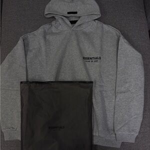 Essentials Men's Grey Pullover Hoodie with Black Logo